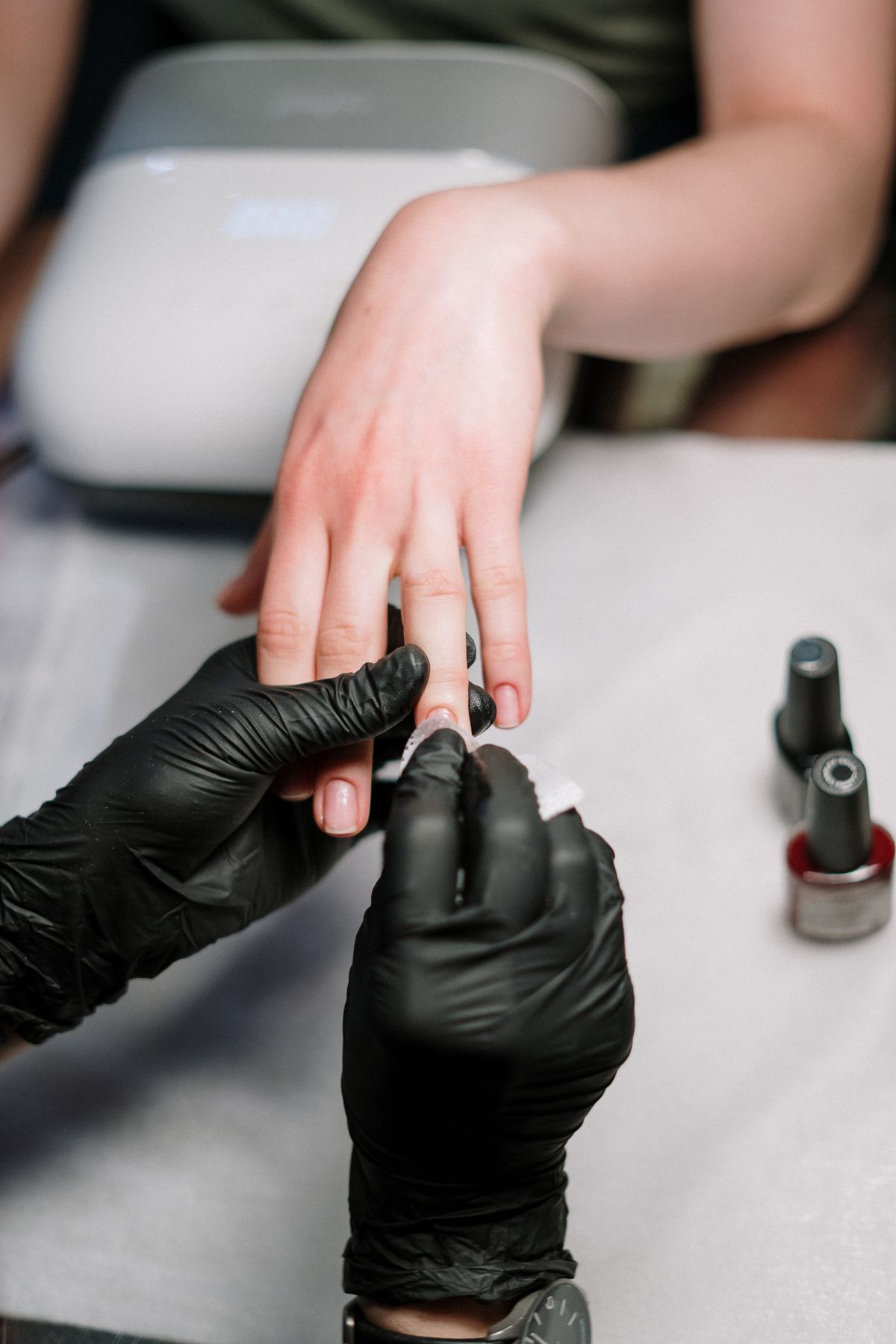 Gel manicure in progress at a nail studio