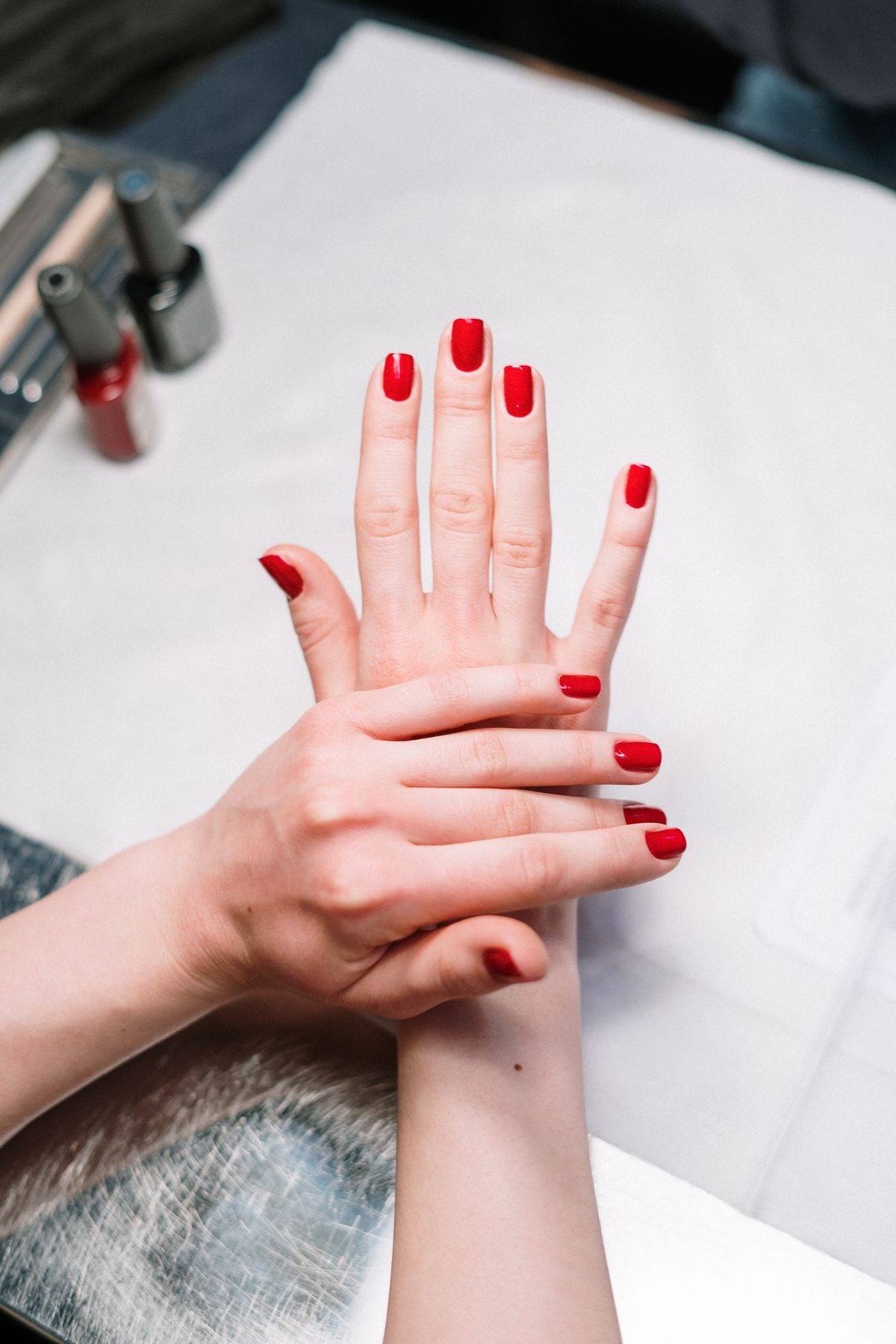 Nail technician detail work on a manicure